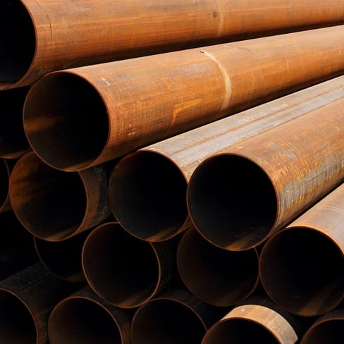 depositphotos_74566903-stock-photo-stack-of-rusty-pipes
